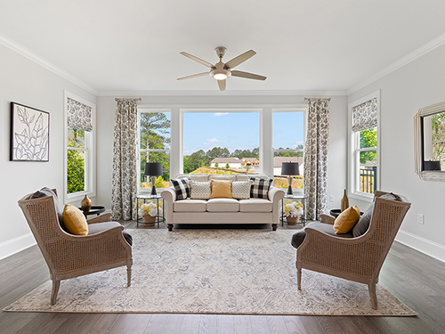 Enjoy the cool air in a four-season sunroom, shown here in the Buckley.>